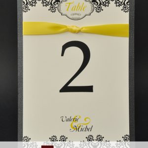 table numbers, yellow, black, floral